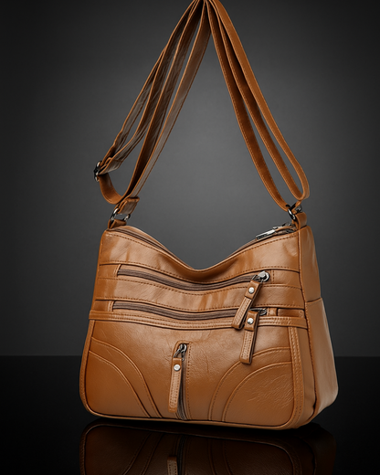 Bolso con múltiples compartimentos y textura suave