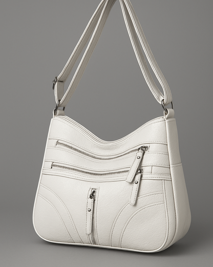 Bolso con múltiples compartimentos y textura suave